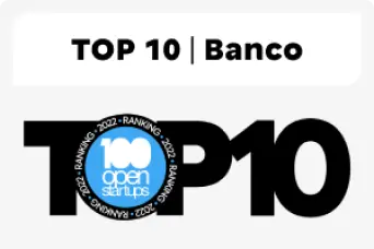 Imagem de um texto, em que o título é TOP 10 Banco, na cor preta. Abaixo, há a palavra Top 10 também na cor preta, sendo que dentro da letra "o" há o texto 100 open startups, num fundo azul. Na borda da letra "o" está escrito Ranking 2022, repetido quatro vezes.